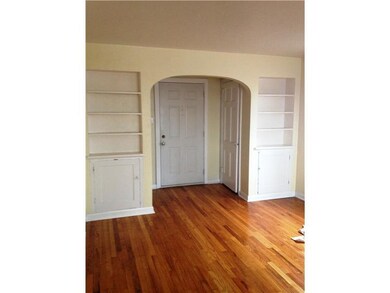 Entry/Foyer. Quality built-in cabinets flank an ar