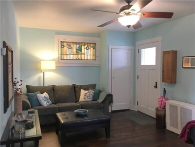 Living room with stained glass, coat closet and ce