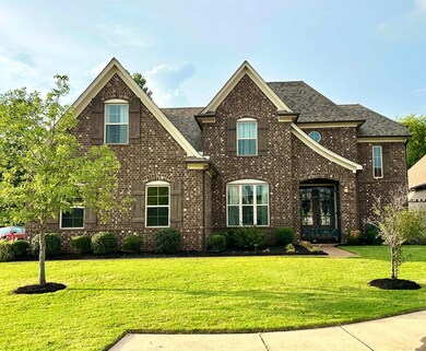 View of front of house with a front lawn and frenc