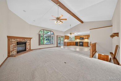 Great Room with Beamed Vaulted Ceiling and Gas Fireplace