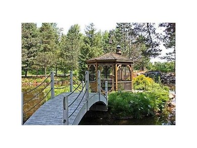Exterior Front. Cross the bridge to the screened i