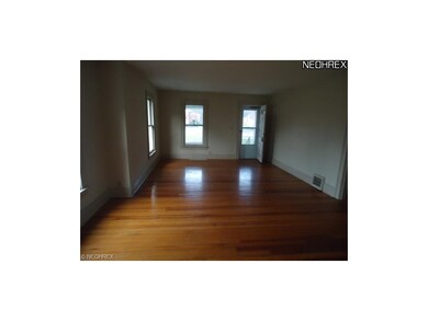living room has hardwood floors