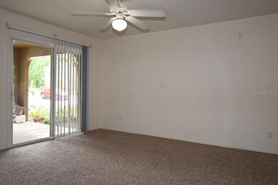 Living Rm with slider to cover porch