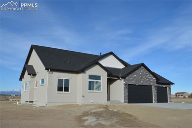 Insulated oversized three car garage with door ope