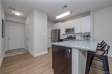 Living room view to the foyer with ceramic tile fl
