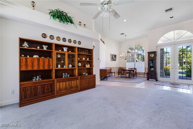 Sitting room featuring visible vents, carpet floor