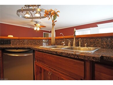 Kitchen with stainless appliances, fixtures, and double sink.