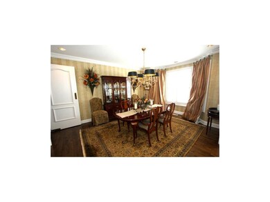 Espresso wood floor in the FORMAL DINING ROOM