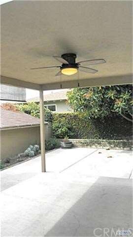 Lanai or covered patio with fan & screen directly 