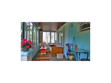 Cozy screened in front porch.