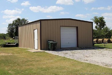 Shop has concrete pad and large open space for sto
