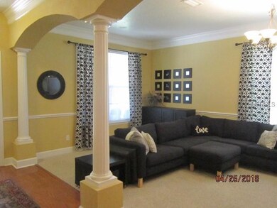 Formal living area with decorative columns