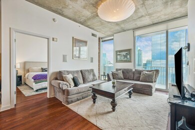 Living room with wood finished floors and healthy
