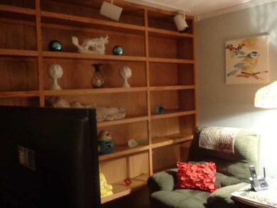 Den. Cozy Den, with Floor to Ceiling Bookshelves. 
