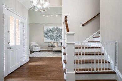 Grand entrance with cathdral ceilings.