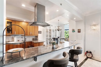 Kitchen with island range hood, inlaid floor detai