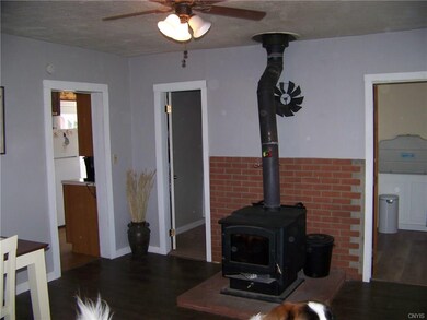 This wood stove heats up the entry room & the whol