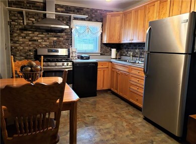The kitchen comes equipped with appliances includi