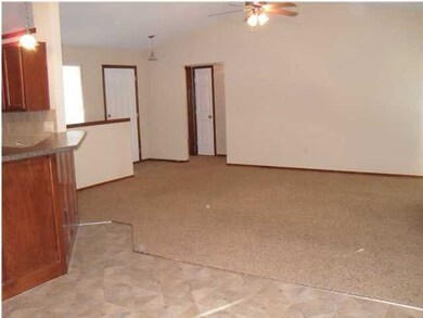 View of the living room from the dining area. This
