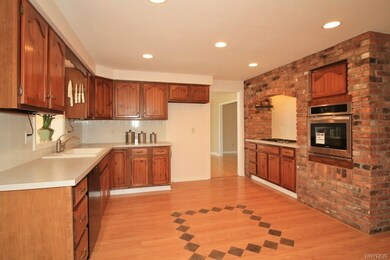 Spacious kitchen features newer dishwasher, wall o