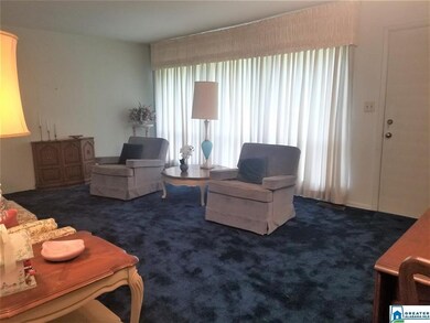 The living room appears to have hardwood floors un
