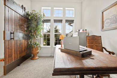 Large Study/ Dining Room with Custom Barn Door at the Front of the Home