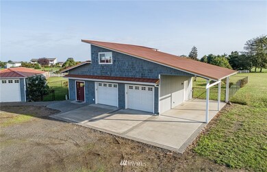 2-Car Garage with workshop, carport and 2 story (864 SF) studio with viewing deck.  Detached single car garage.
