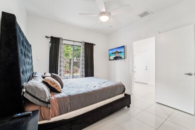 First floor bedroom with view to entry hall. Floor