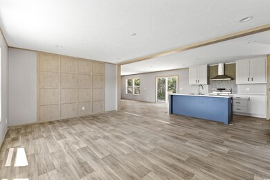 Kitchen with a center island with sink, stainless 