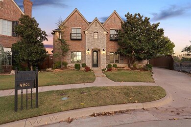 View of front of property featuring a lawn and a b
