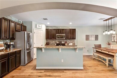 Kitchen features granite counters, 36 inch espress