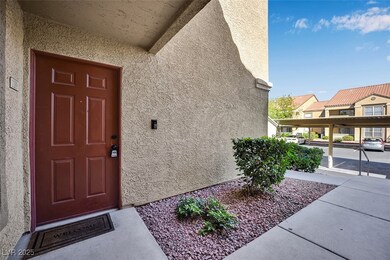 Doorway to property featuring stucco siding