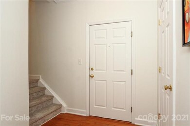 Front door and stairs leading up to the 2 bedrooms