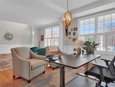 Office area with hardwood / wood-style flooring, a