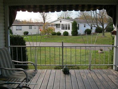 Patio/Deck. Front porch area.  Canvas awnings.