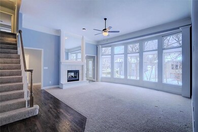 SPACIOUS LIVING ROOM W/FLOOR TO CEILING WINDOWS & 