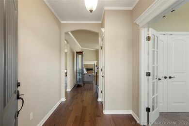 Spacious entry with engineered wood which continue