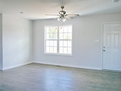 Room for sectional, Lazaboy, and big comfy chairs. Laminate floors in all rooms except baths.