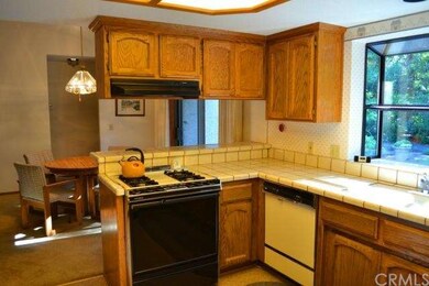 The kitchen peninsula is open to the dining area.