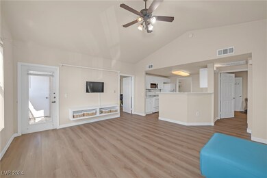 Unfurnished living room featuring visible vents, c