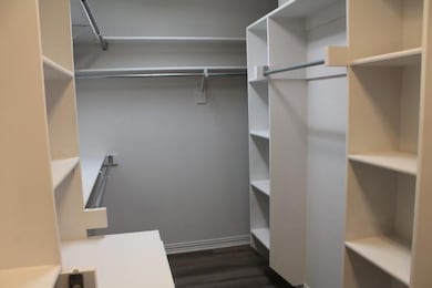 Primary bedroom walk-in closet