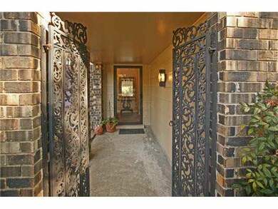Very unique entry with rod iron gates!