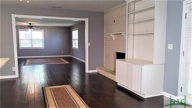 Enter from carport door with expansive view into l