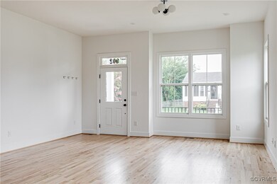 Foyer featuring wood finished floors and baseboard
