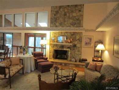 Formal living room featuring a gorgeous stone gas 