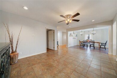 LIVING ROOM WITH A VIEW OF DINING AREA
