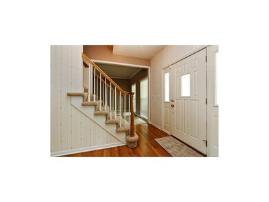 Opens to hardwood floors which carry through to ki