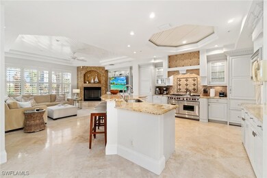Kitchen with a raised ceiling, double oven range,