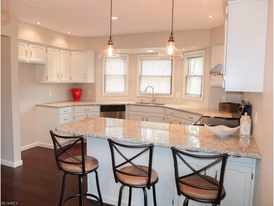 Kitchen has a breakfast bar.