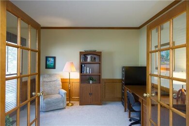 Main floor office/den is near the front entry, and